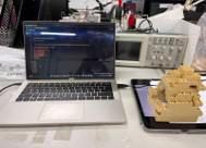 Laptop, oscilloscope and LEGO rig on a lab bench